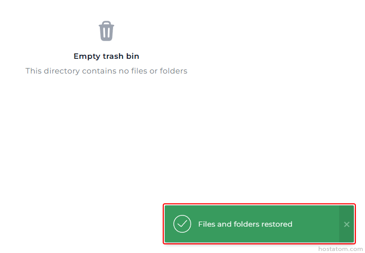 Icon indicating an empty trash bin in a file manager, with a green 'Files and folders restored' success notification on the bottom-right.